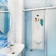 A blue bathroom with a sliding shower door.