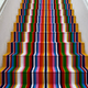 A multi-colored striped set of stairs.