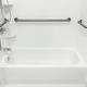 white fiberglass tub and shower with safety handles
