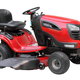 A red and black riding lawn mower.