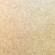 Close-up on the texture of a piece of particle board.