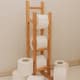 toilet paper roll on wooden freestanding holder