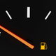 An automobile fuel gauge on empty.