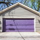 A home garage door, painted purple.