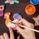 hand painting chicken ornament with other ceramic designs