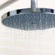 water falling from a rain-style shower head