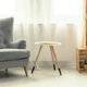 interior design with crates, chair, table, and curtain