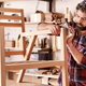 man building wood chair