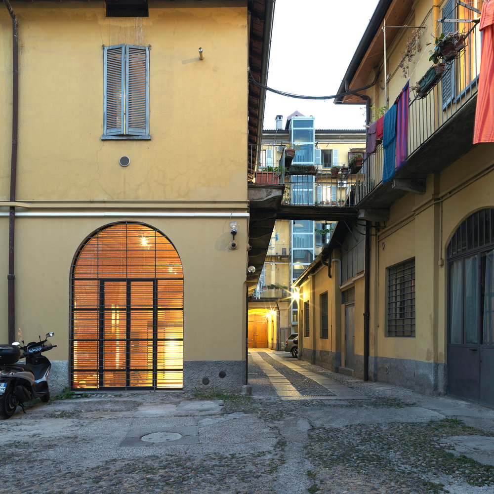 Exterior of converted Milan garage living space