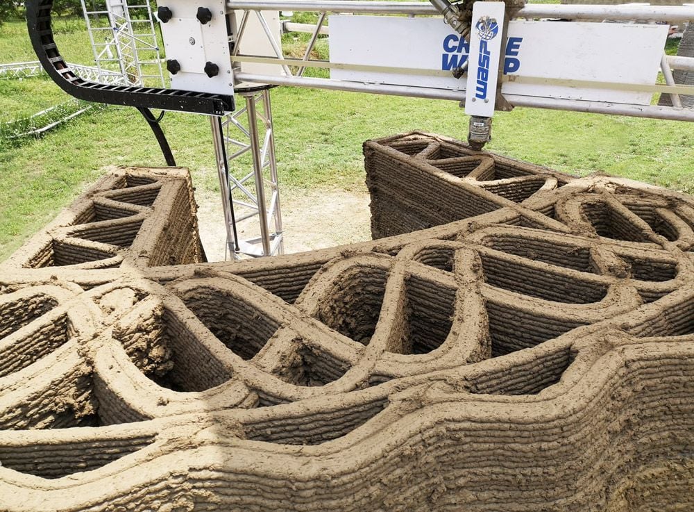 Close-up view of the TECLA raw earth house's 3D printing construction progress.