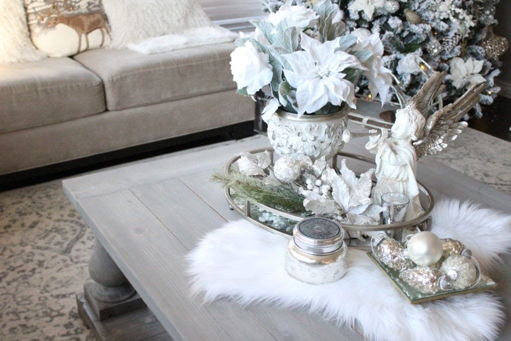 Seasonal white coffee table vignette from designer Summer Adams