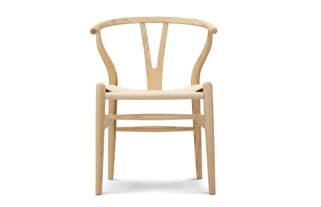 Originally invented by Hans Wegner, the Wishbone Chair is now a Scandi style staple.