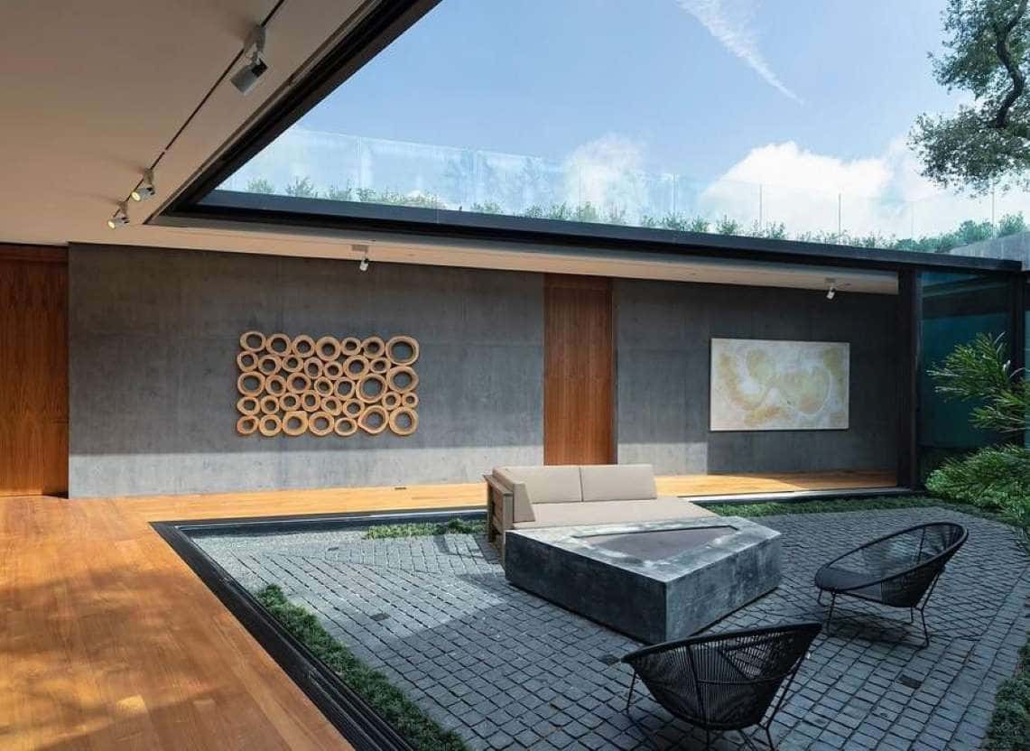 A tranquil, concrete sunken courtyard lays at the heart of Kao's new mansion. 