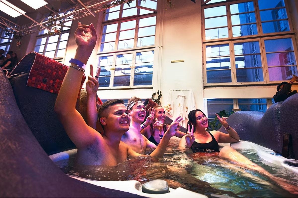 Berlin Premium Fashion Week attendees enjoy a warm soak in the Hornbach Sneaker Pool.