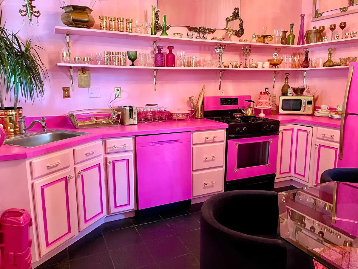 Bold pink kitchen space inside the Barbiecore-inspired 