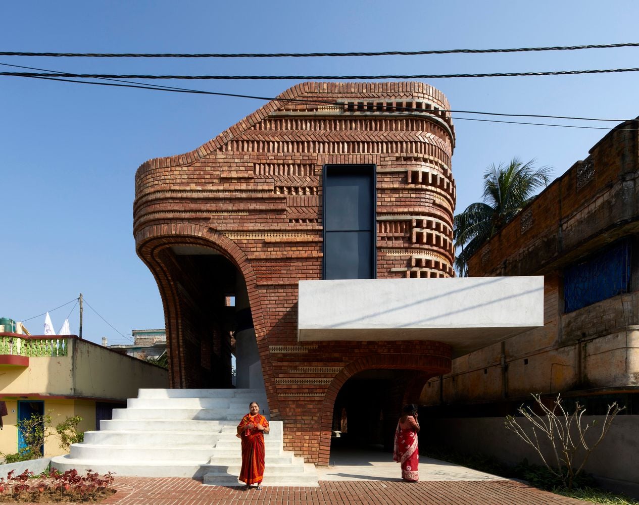 Bricks Go Bold with Organic Shapes and Patterns Based on Bengal Temples