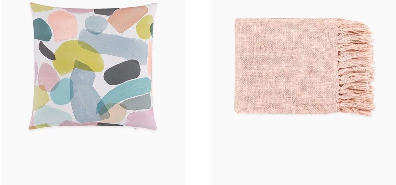 A pillow and blanket from Reese Witherspoon Havenly Design Collection
