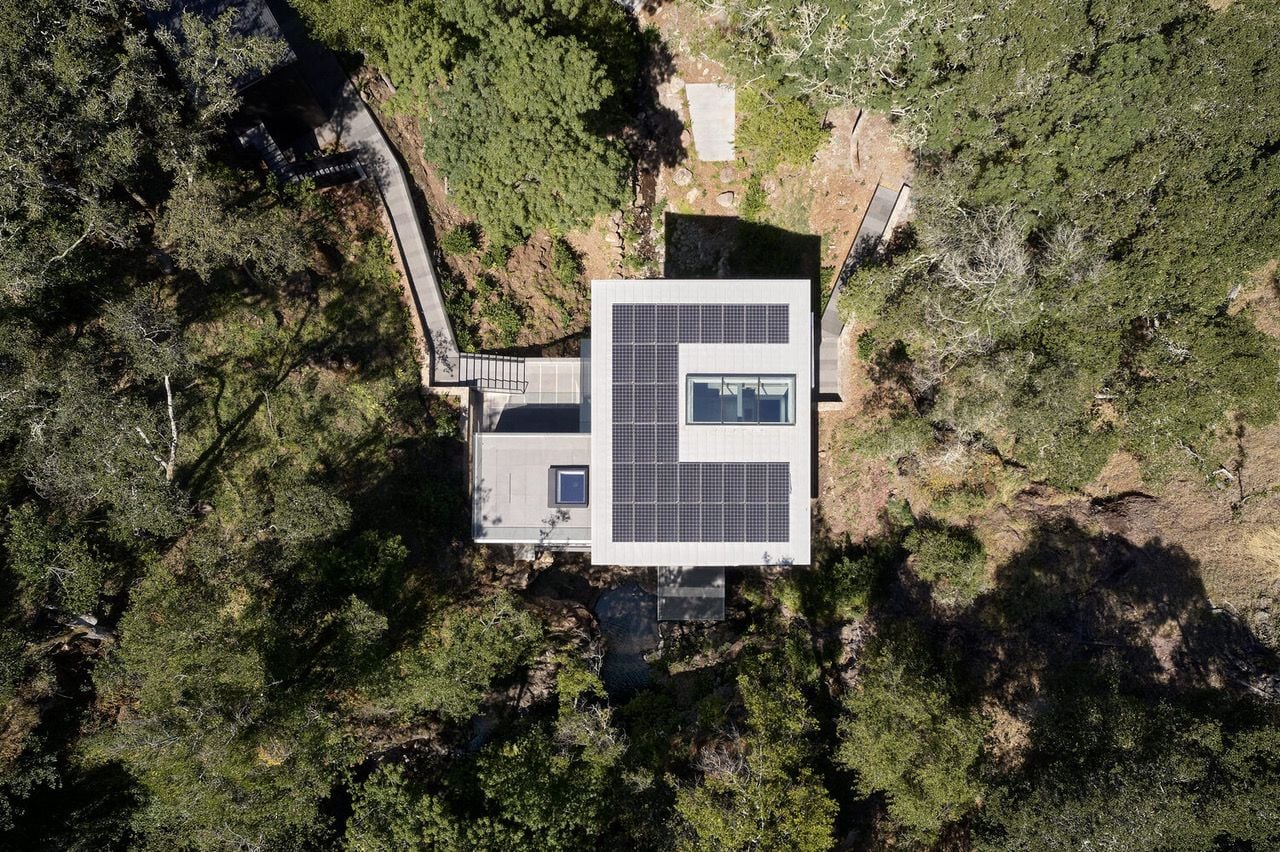 Aerial view of the creek-spanning Suspension House in rural California.