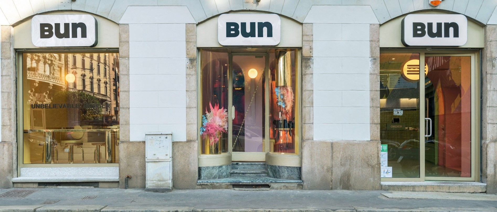 Deceptively simple exterior of the Masquespacio-designed Bun burger restaurant on Milan's Via Dell'Orso.