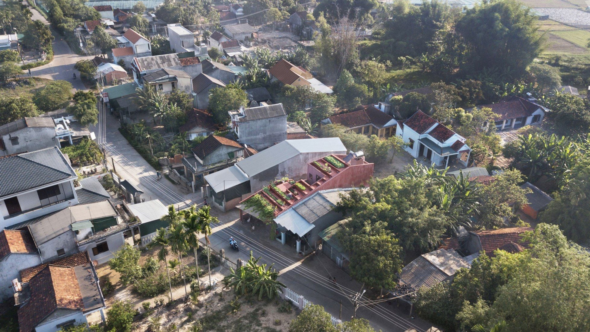 Far-off shot of TAA's new Red Roof design in a Vietnamese village. 
