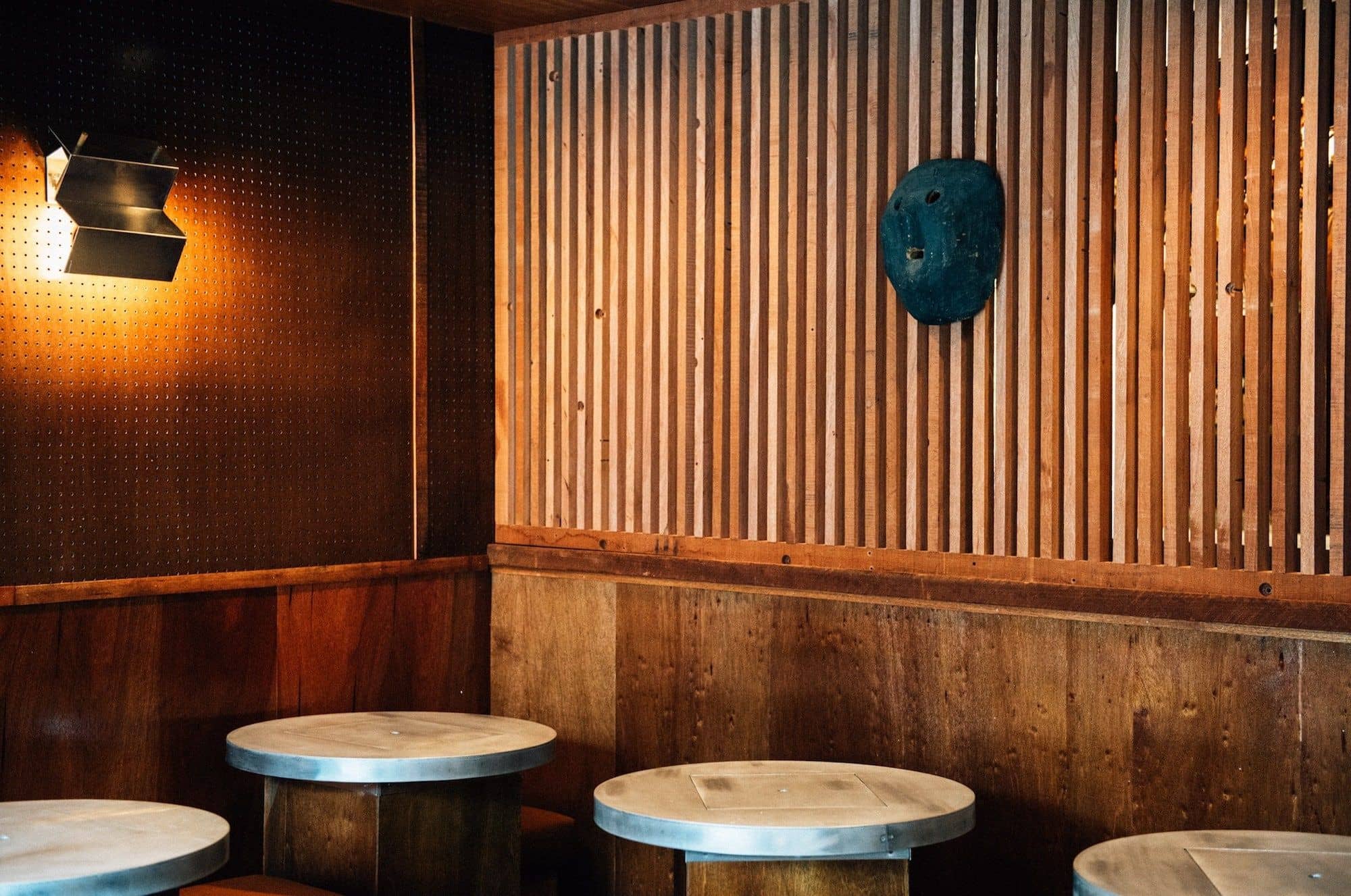 The interiors of Dr. Clark are dominated by coffee-stained plywood and traditional Hokkaido accent pieces.