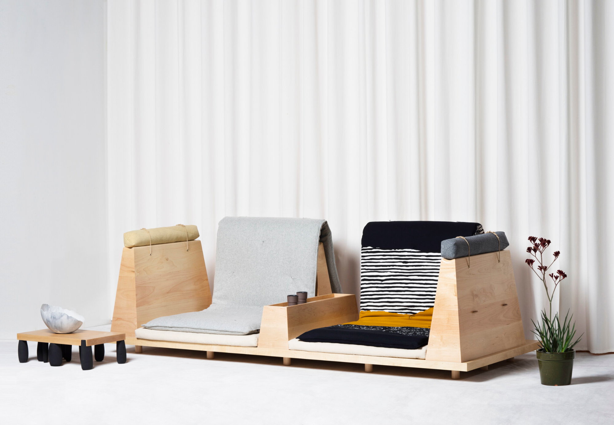 The simple wooden Zabuton Sofa from UMÉ takes inspiration from traditional Japanese floor mats. 