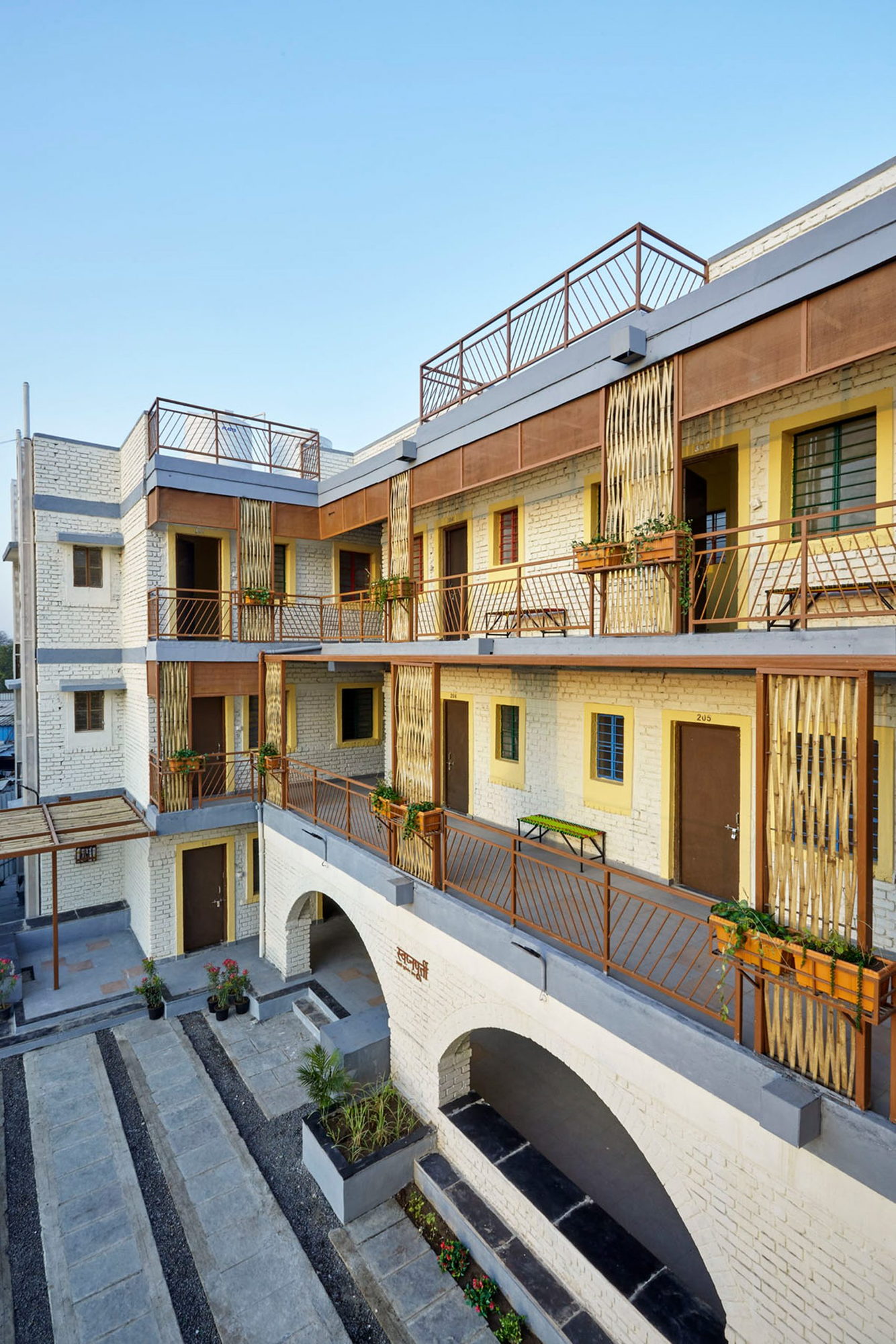 Bright housing units by the CDA liven up Ahmednagar's historically impoverished Sanjaynagar neighborhood.
