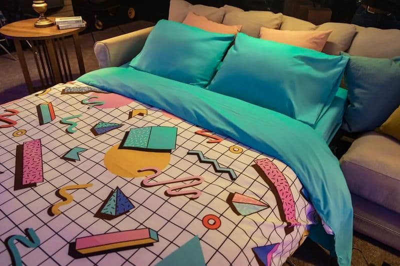 This 90s-inspired fold-out bed is perfectly representative of the furnishings you can expect to find while staying the night at Blockbuster Bend. 
