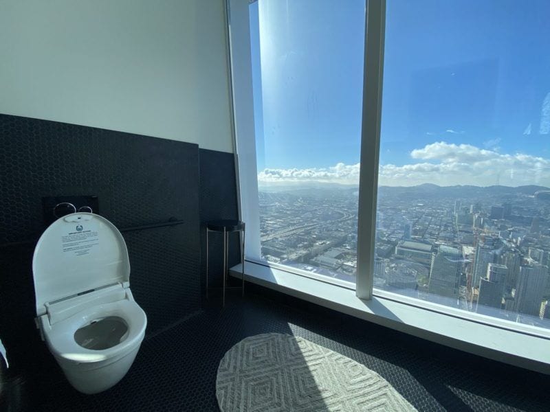 TrueLoo Smart Toilet in a public facility with a view.