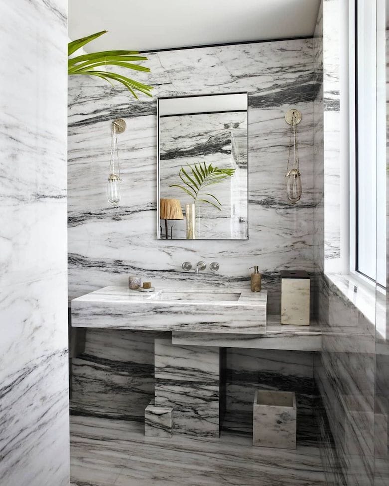 Stone slabs are used to striking effect in this contemporary bathroom by Lynn Byrne. 