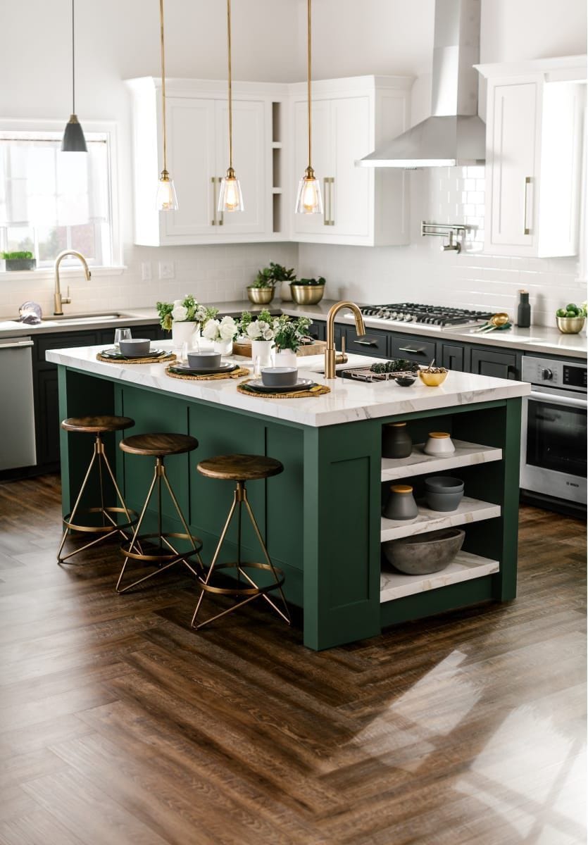 Subtle dark green cabinets on this kitchen island provide a nice splash of color without overwhelming the space.