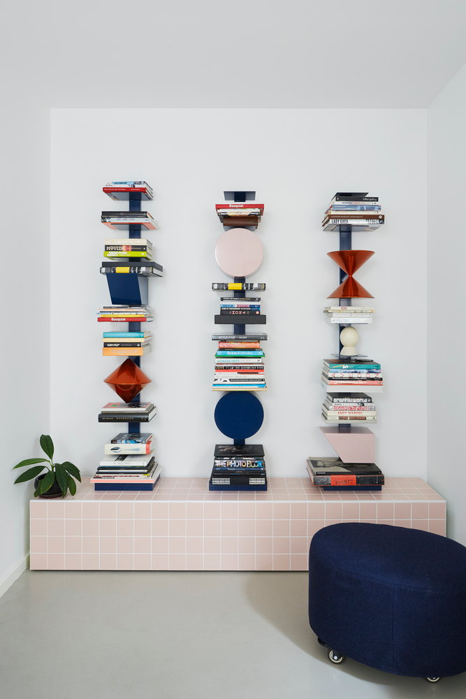A fun, pastel pink bookshelf featured in the ultra-accessible Frenches Interiors.