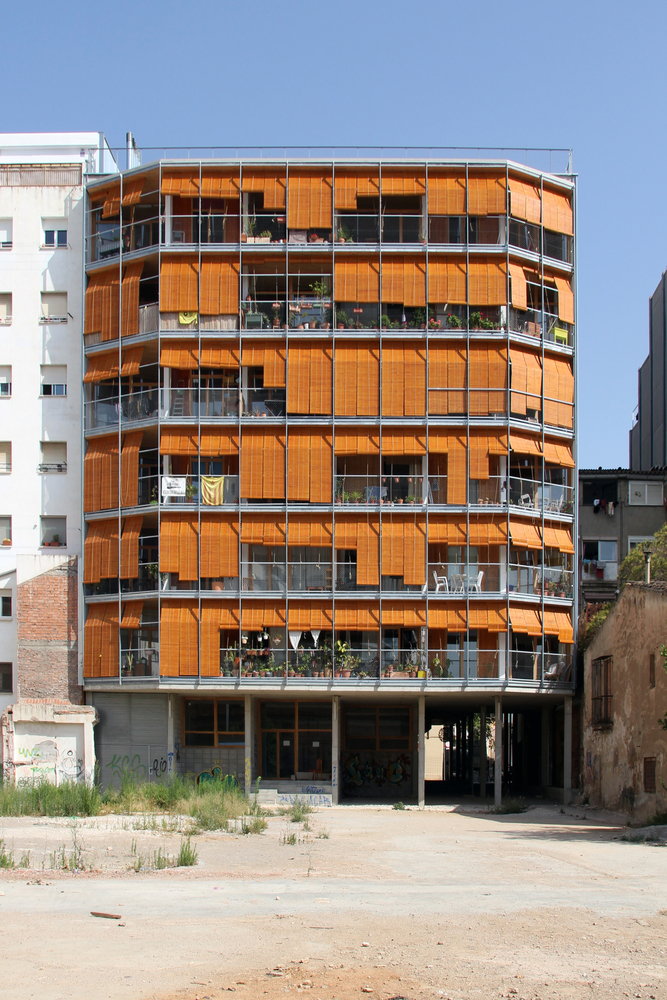 Exterior view of the multi-level La Borda housing co-op in Barcelona, Spain.