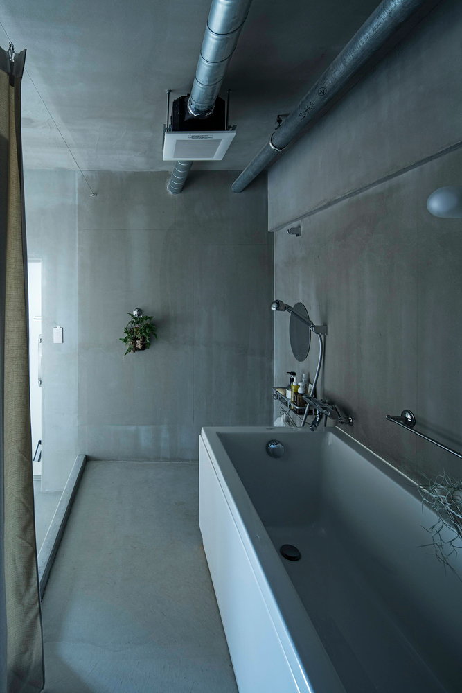 Concrete bathroom area inside a YAP-renovated Kyoto condo 