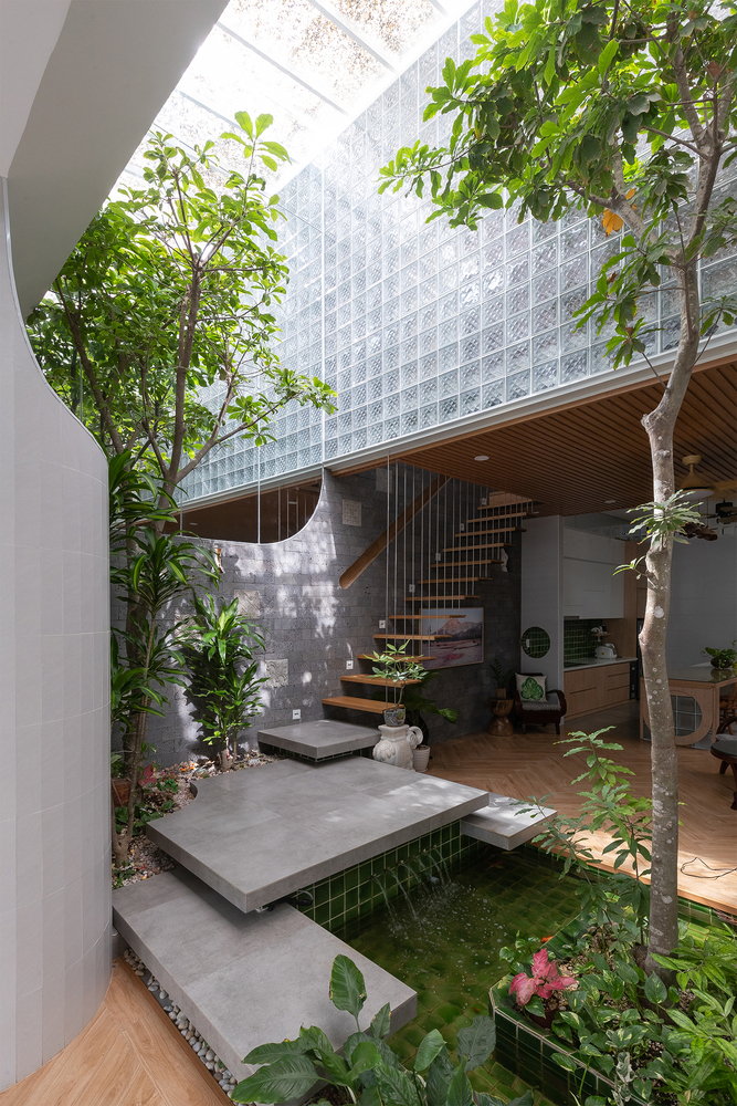 Tranquil lower-level garden in Vietnam's Coco House.
