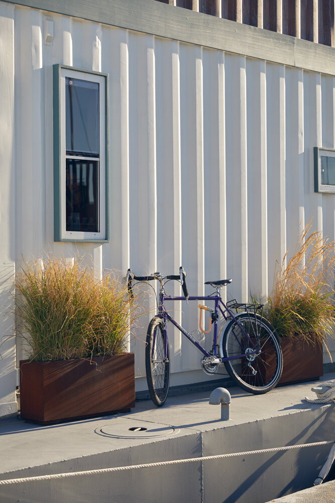 Bicycle neatly perched on the side of the sustainable floating 