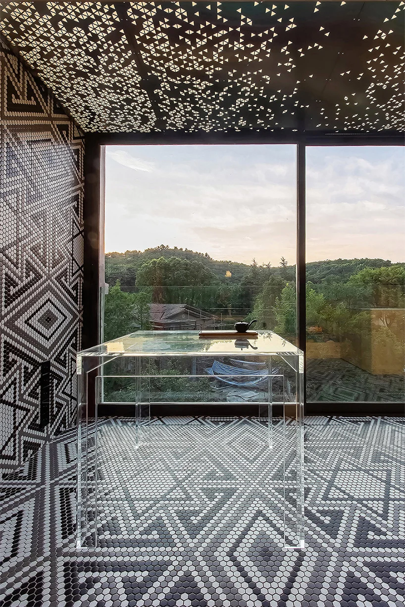 Bold black and white tile mosaic lines the spacious lookout area inside the Live and Fun apartment.