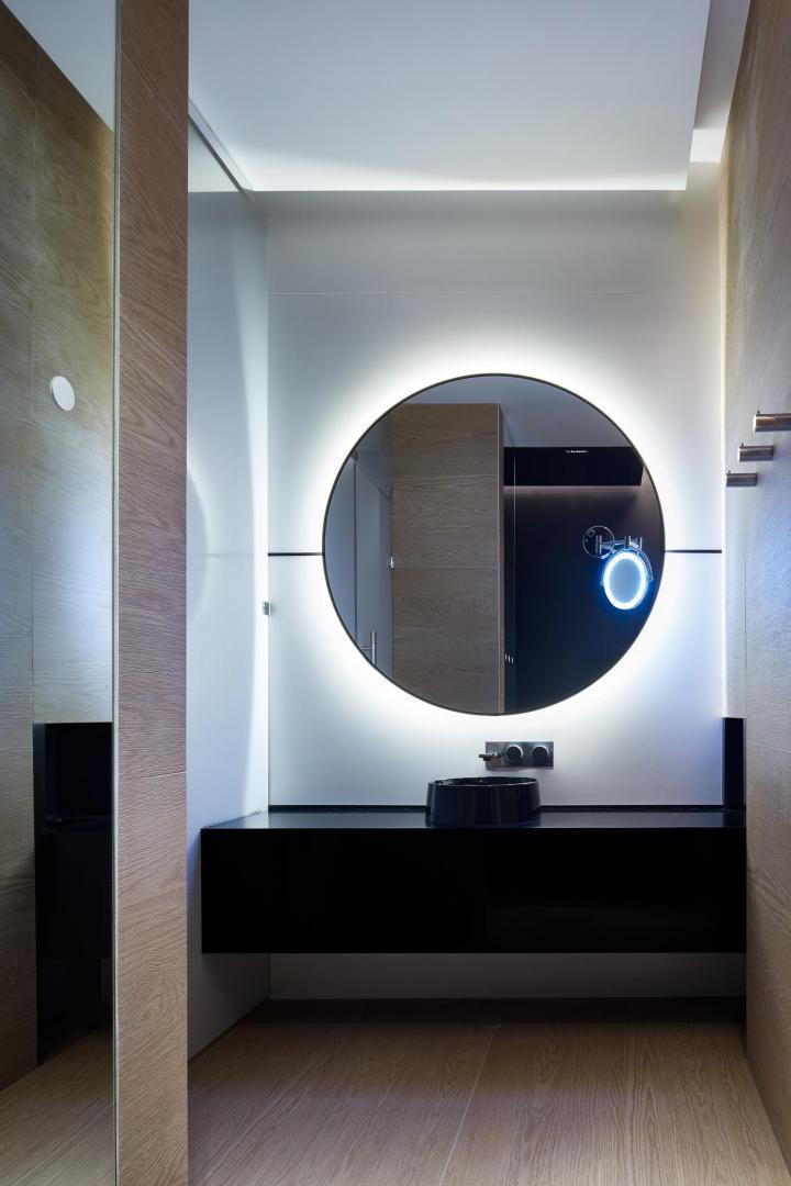A bathroom vanity inside the Gagarin International Airport's new VIP Lounge, characterized by round shapes and sleek white surfaces.