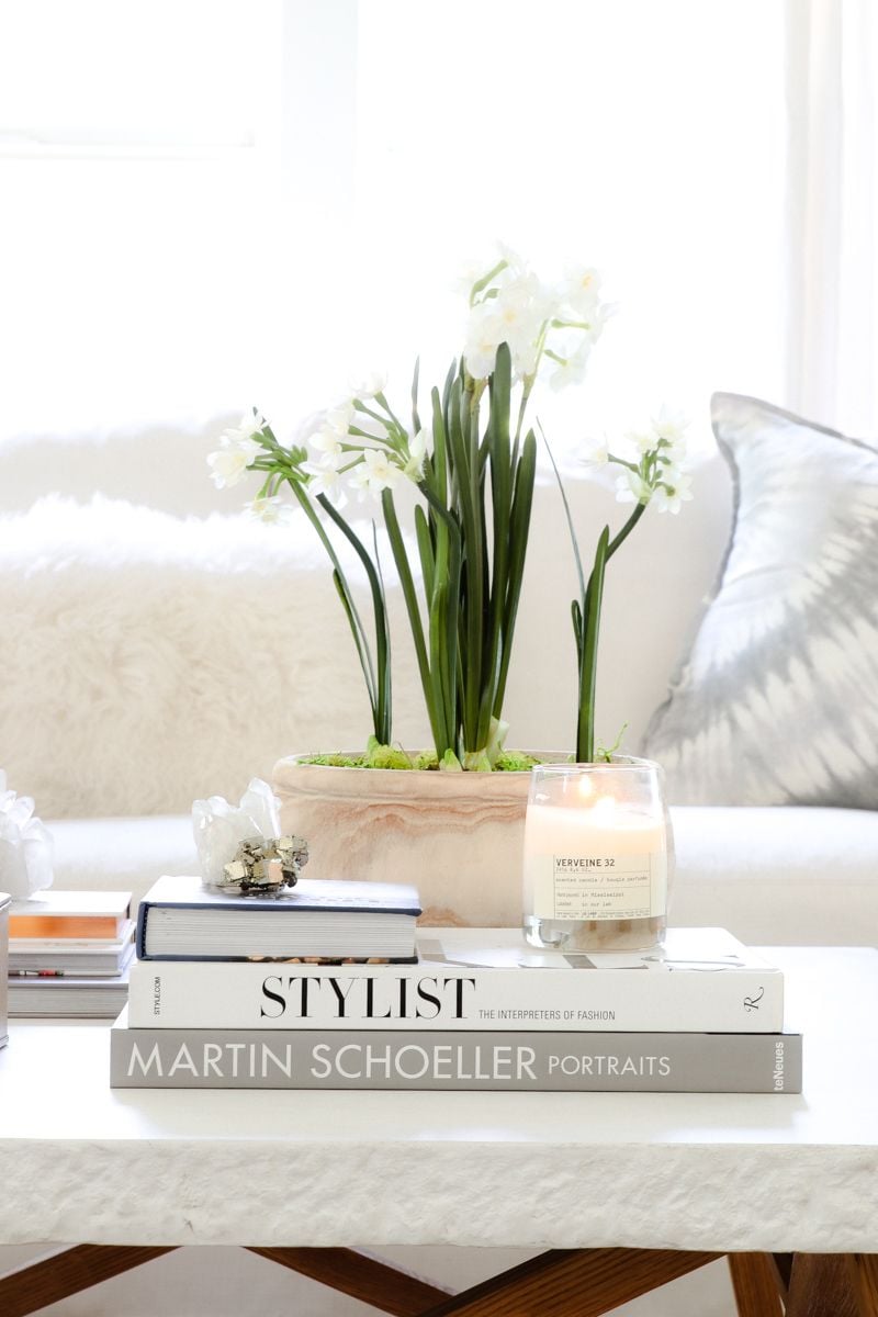 Ashley of Modern Glam used bulbs on this coffee table to create compact spring floral decor that lasts a lot longer than a typical bouquet.