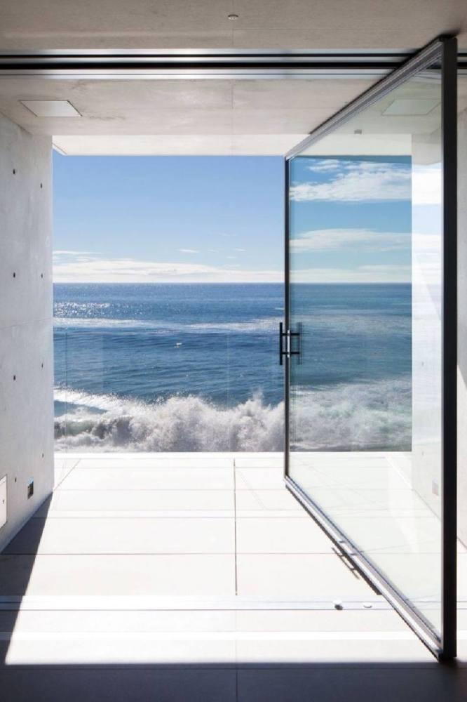 Expansive views out at the Pacific Ocean from Kanye West's new Tadao Ando-designed Malibu beach house.