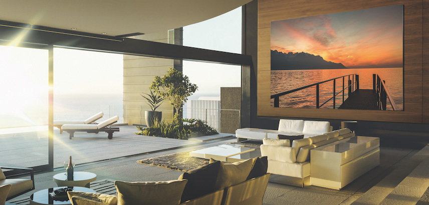 Samsung's massive The Wall MicroLED TV mounted in a contemporary home. 
