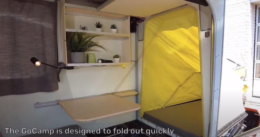 The inside of the GoLo GoCamp's RV module is surprisingly spacious, complete with storage, shelves, and a fold-out dining table.  