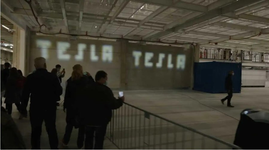 The Tesla Model Y's new ADB headlights project the word 