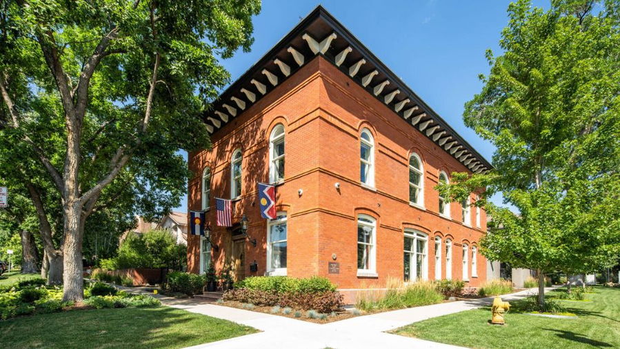Brick facade of Denver's Historic Harman Hall home, currently on the market for $15 million.