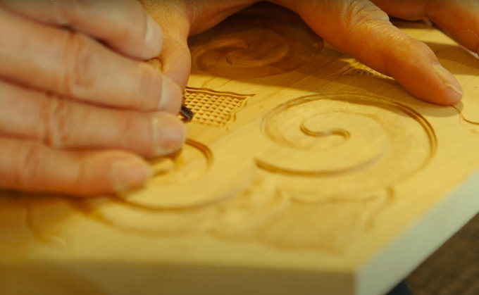 Intricate Ainu wood carving pattern.