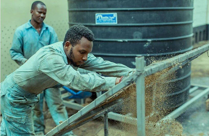 Matee's Gjenge Makers Ltd. team mixes sand with recycled plastics to produce the finished bricks. 