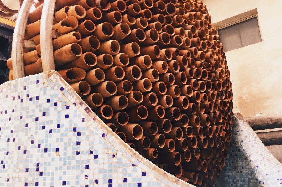 Dozens of terracotta pipes are bunched together to form Ant Studio's Beehive structure.