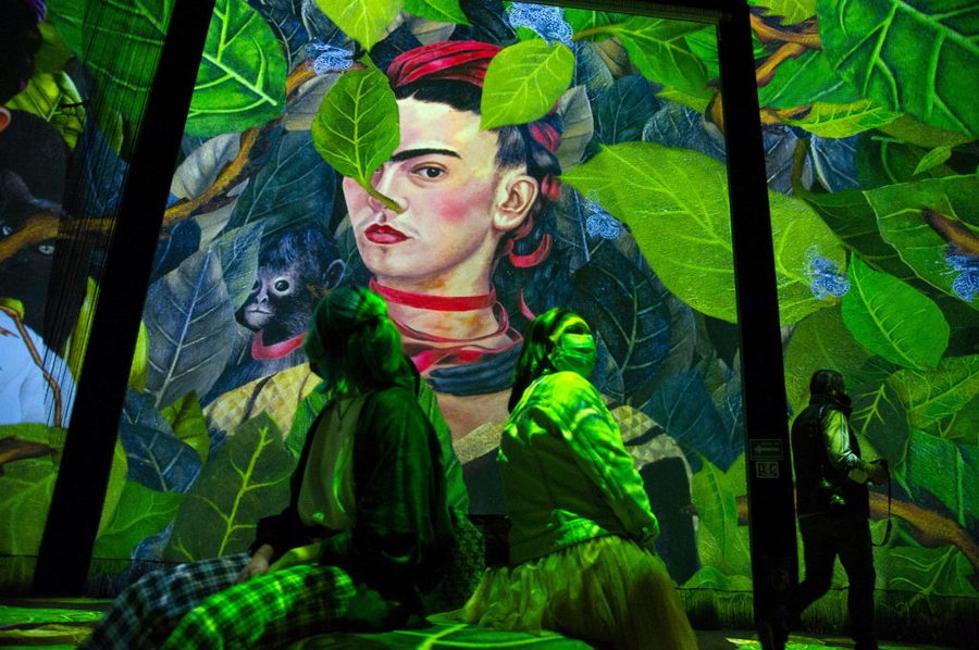 Close-up view of Frida Kahlo in a jungle setting, as featured in Lighthouse Immersive's interactive 