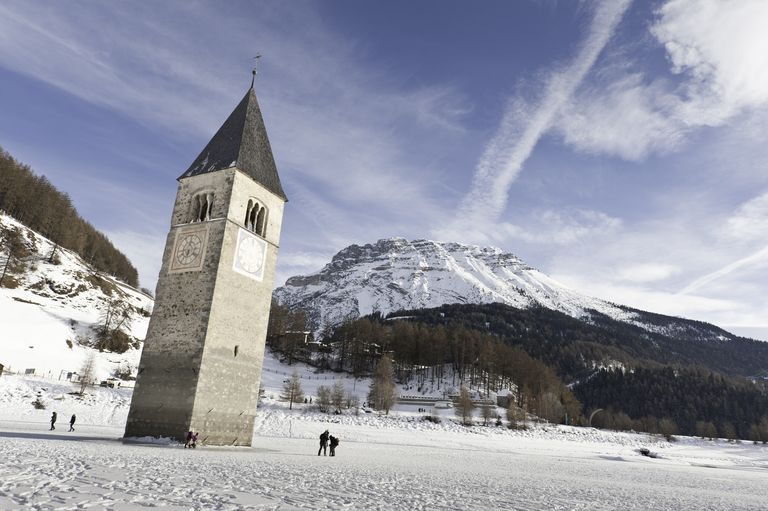 When Lake Resia freezes over in the wintertime, visitors can walk directly up to the sunken Curon bell tower. 