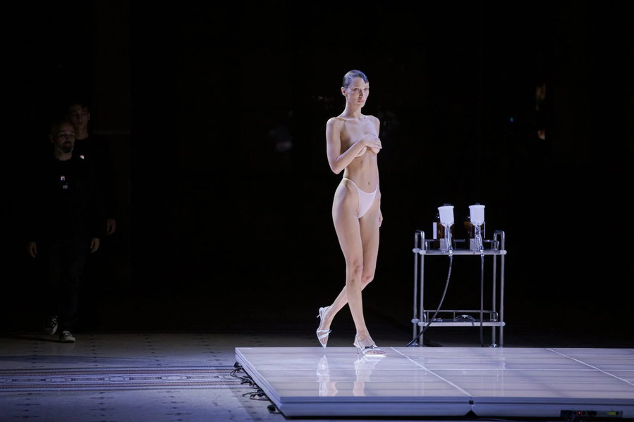 Bella Hadid took to the stage at the Coperni show wearing nothing but a white thong and high heels.
